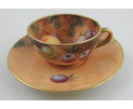 A Royal Worcester miniature tea cup and saucer, decorated with fruit by Roberts&nbsp;