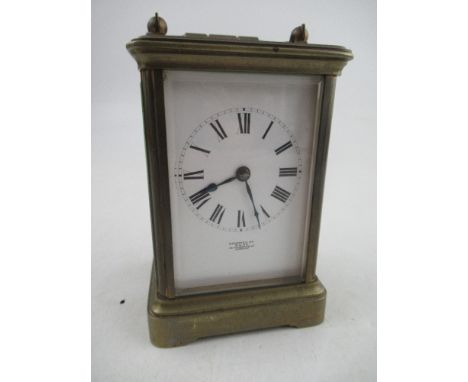 A 19th century French Carriage clock, with roman numerals to the face with key, in working order&nbsp;