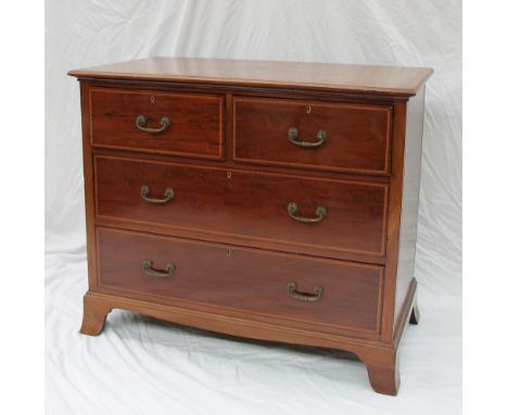An Edwardian mahogany chest, the rectangular inlaid top above two short and two long drawers on bracket feet, 99cm x 54cm