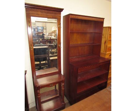 A 20th century hall stand with a central rectangular mirror, brass hooks, shelf and base on bracket feet together with two bo