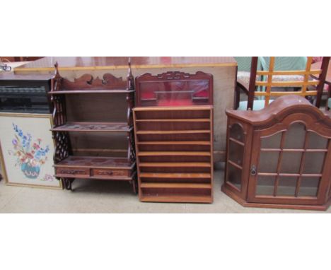 A Chinese hardwood wall mounted display cabinet together with four other display cabinets and a tapestry picture