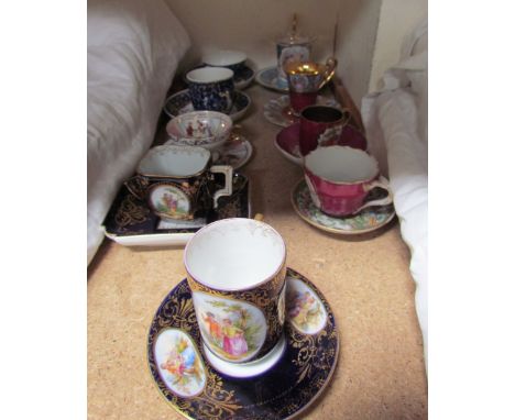 A Vienna style cabinet cup and saucer, painted with figures in a landscape, underglaze beehive mark together with other decor