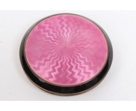 Early 1930s Continental silver powder compact of circular form, with engraved turned decoration and hinged cover decorated in