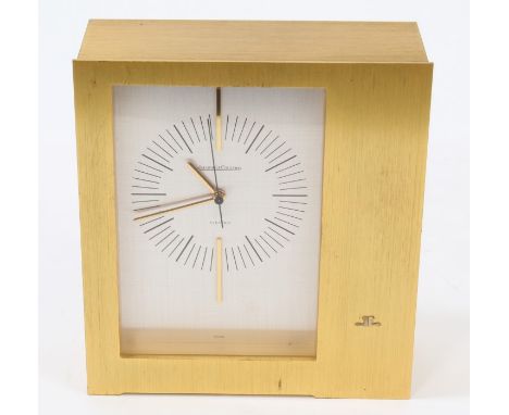 1970s Jaeger-LeCoultre electric mantel clock with silvered dial with gilt hands and '12' and '6' batons, gilt brushed brass c