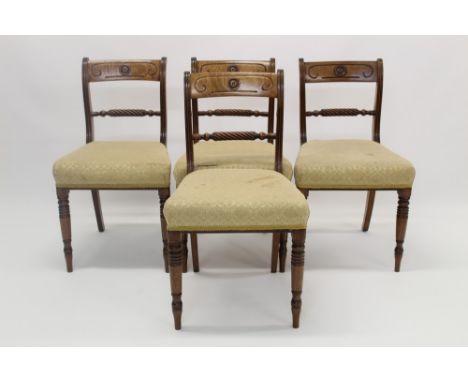 Set of four Regency fruitwood bar back dining chairs, each with roundel carved top rail and horizontal barley-twist back, hav