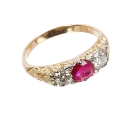 Ruby and diamond three-stone ring with round mixed cut ruby estimated to weigh approximately 0.60 carats, flanked by an old c