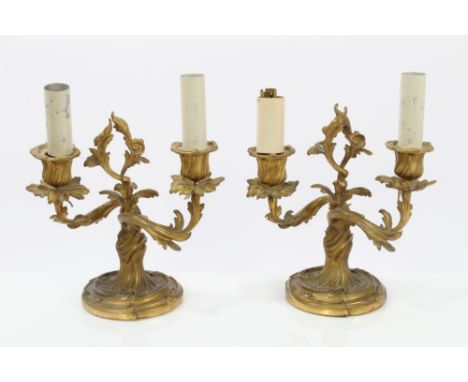 Pair 19th century-style French ormolu two-branch candelabra - converted to electric lamps, with rococo scroll decoration, 22c