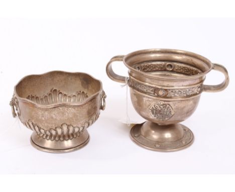 Small contemporary Irish silver rose bowl of half-fluted circular form, with wavy rim and twin lion mask ring handles, on a c