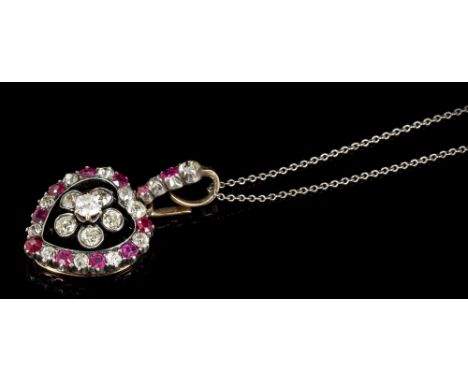 Edwardian diamond and ruby heart-shape pendant, with a central flower-head cluster of old cut diamonds surrounded by a border