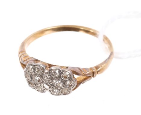 1930s diamond ring with a double flower cluster of single cut diamonds with pierced gallery, on bifurcated shoulders and 18ct