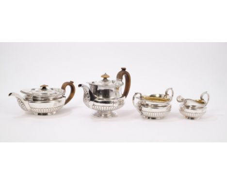 George IV silver three piece tea set of half-fluted form - comprising teapot with engraved crest and initial, gadrooned borde