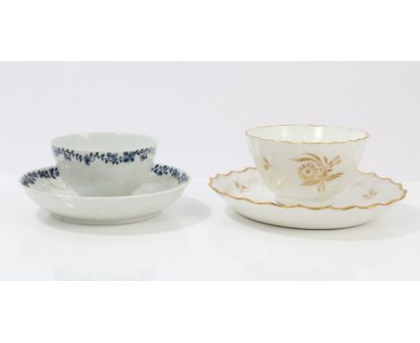 18th century Lowestoft blue and white tea bowl and saucer with moulded floral decoration and blue and white painted floral bo