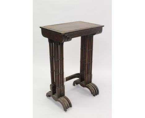 Nest of four 19th century rosewood tables, each with rectangular top with bead gallery raised on ring-turned column supports 