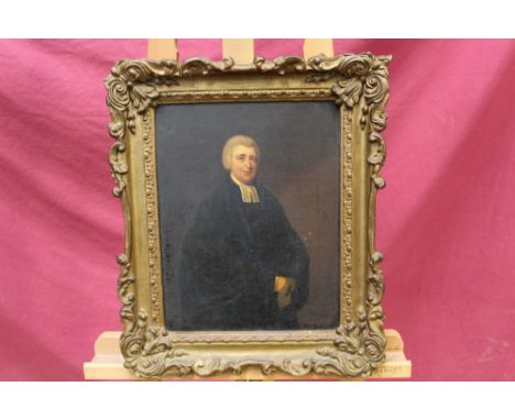 19th century English School oil on canvas - portrait of a clergyman, in gilt frame, indistinct handwritten note and Frost & R
