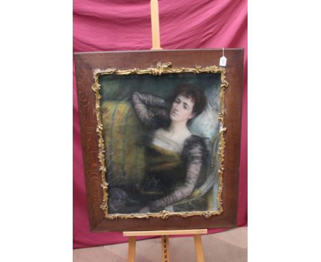 Late 19th century Continental School oil and pastel on canvas - portrait of a lady seated on a sofa, indistinctly signed, dat