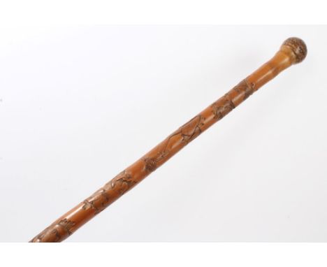 Late 19th / early 20th century Japanese carved bamboo walking stick with root knop, carved in low relief with animals, fish a