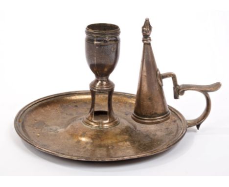George IV silver chamberstick of dished form, with engraved armorial crest, central candle holder with wick trimmer aperture 