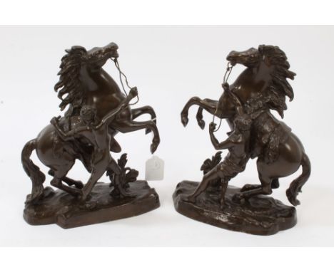 Pair of patinated bronze Marley horse groups, stamped 30 to base, 30cm high