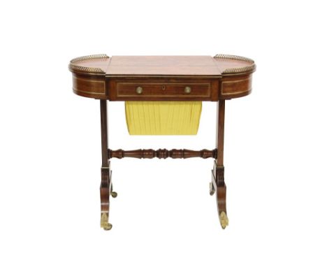 Regency rosewood and brass mounted ladies' writing / work table, the well figured top with central adjustable easel slope fla