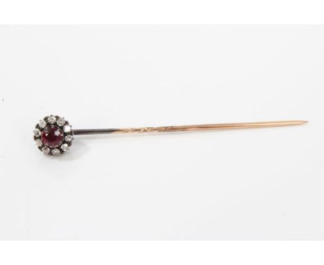 Victorian ruby and diamond cluster stick pin with a central mixed cut ruby surrounded by old cut diamonds, 8.5mm diameter