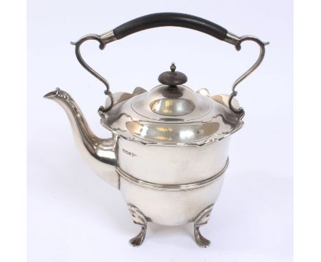 George V silver kettle of inverted bell form, with shaped flared rim and central reeded band of decoration, scroll handle wit