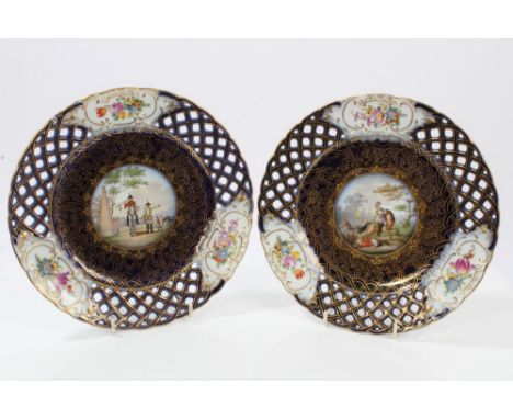 Pair early 20th century French Sèvres porcelain dessert plates - both painted with military scenes within pierced borders wit
