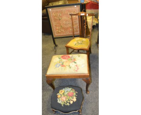 An early 20th century oak side chair, embroidered cushion seat; similar foot stool; an early 20th century firescreen, embroid