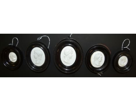 A set of five paste glass medallion portrait plaques, in the manner of James Tassie, Vespas, Germanic and others, 7cm x 5.5cm