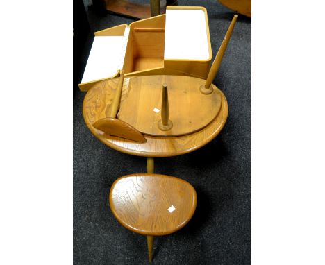A nest of Ercol coffee tables, trio tapered legs; a 1960's cube design storage unit on teak casters