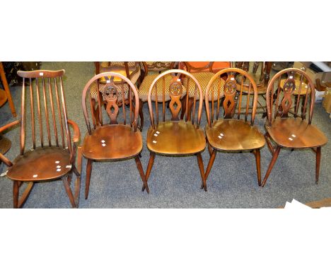 A set of four Ercol dining chairs; an Ercol stick back rocking chair