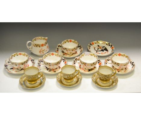 A Crown Derby  Porcelain part tea service, comprising five teacups, six saucers and milk jug, decorated in the Imari palette,