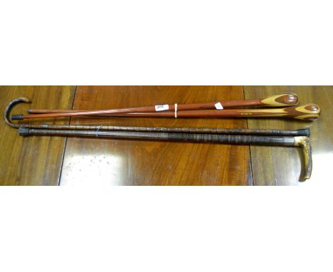 Walking sticks- a horn hafted walking stick; another with silver ferrule; a pair of inlaid walking sticks, etc (4)