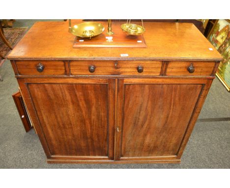 A Victorian mahogany sideboard, two short drawers, turned handles, above fielded panel doors,  c.1890