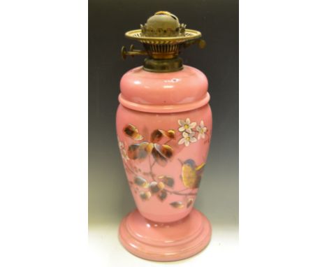 A Victorian oil lamp, painted with leaves and foliage, c.1870