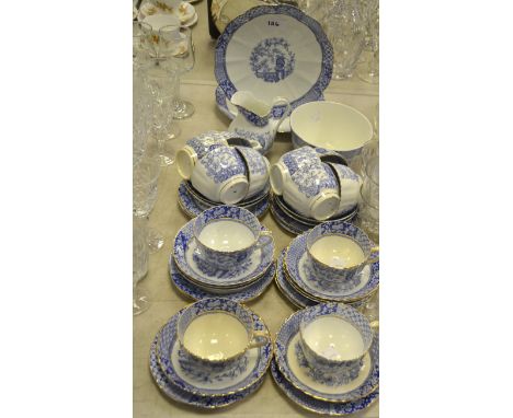An Edwardian six-setting tea service, transfer printed in blue, comprising a pair of bread plates, milk jug, sugar basin, tea