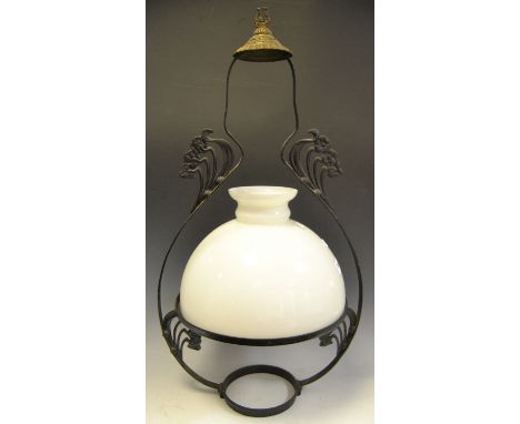 A wrought iron ceiling lantern , domed glass shade