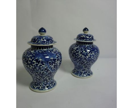 Pair of Chinese Kangxi Style Blue and White Pottery Vases with Covers, Decorated with allover Foliate panels, Four Blue Chara