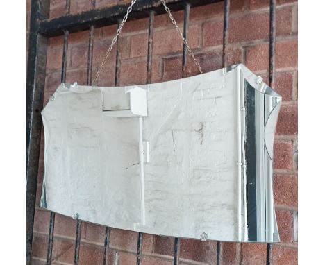 A VINTAGE BEVELLED MIRROR
