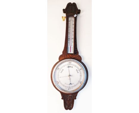 A VINTAGE OAK WALL BAROMETER