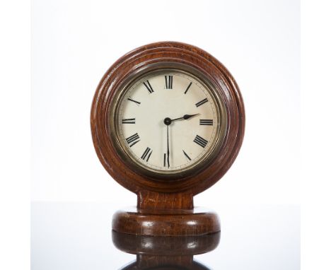 OAK CASED BALLOON-SHAPED OFFICE MANTEL CLOCK
the white dial with Roman numerals, the case in oak, unsigned key wind movement,
