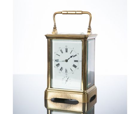 LATE 19TH CENTURY BRASS CARRIAGE CLOCK
the enamel face with Roman numeral chapter ring and subsidiary seconds, lever platform