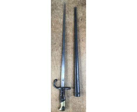 French Gras bayonet M1874 with scabbard, back of blade etched and dated 1876. Blade length 20 1/2” overall length 26”