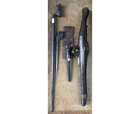 A Reproduction wheellock pistol 56cm long and two bayonets one 1853 pattern socket bayonet (missing locking ring) 63cm long, 