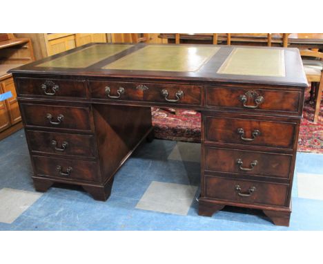 An Early/Mid 20th Century Desk Having Two Banks of Four Short Drawers with Central Long Drawer, Tooled Leather Top , Bracket 