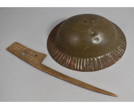 A Vintage Carved Wooden Item, Perhaps Trench Art Bayonet, together with a Pressed Metal Helmet 