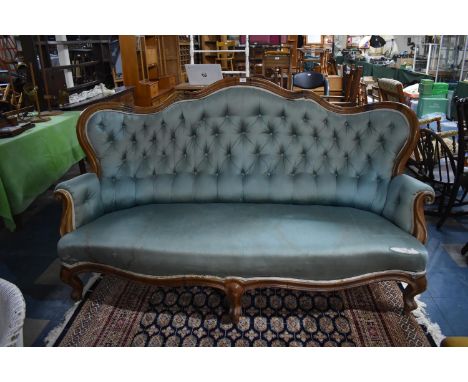 A 19th Century Mahogany Framed Settee Having Winged Humped Back of Serpentine Form with Scrolled Elbow Rests, Button Back and