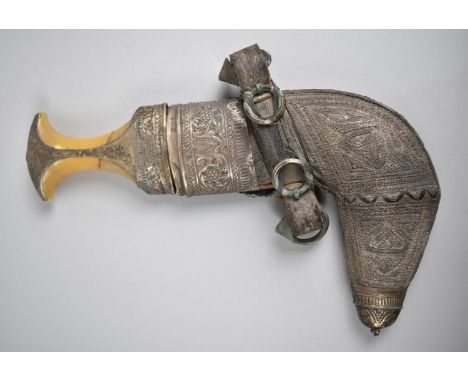 An Arabic Jambiya Curved Blade Dagger with Decorated White Metal Scabbard 