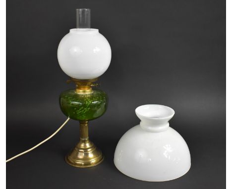 An Electric Converted Oil Lamp Having Domed Brass and Reeded Column Supporting Green Glass Reservoir with Globular Opaque Sha