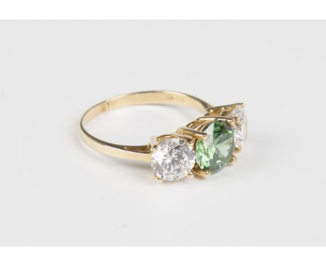 A 14ct gold, synthetic green and colourless gem set three stone ring, weight 3.8g, ring size approx P1/2.Buyer’s Premium 29.4