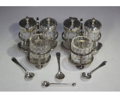 A pair of late Victorian silver trefoil shaped three-piece condiment stands, each with reeded wirework scroll handle and bun 